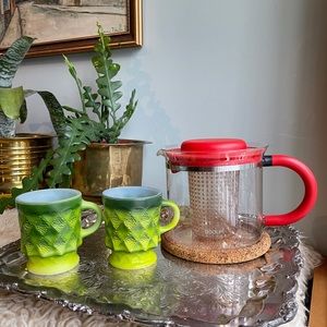 2 fireking green coffee mugs in pristine condition.